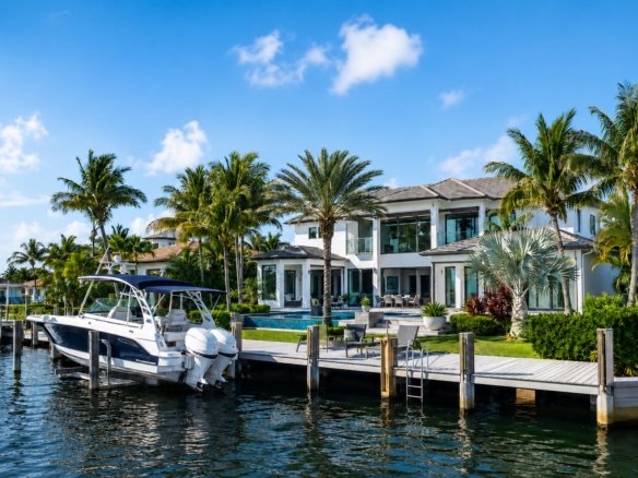 South Florida waterfront home with a private dock and boat